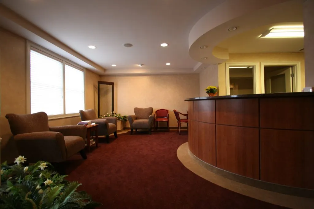 Reception and patient waiting room at {PRACTICE_NAME}
