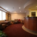 Reception and patient waiting room at {PRACTICE_NAME}